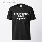 Black t-shirt with white text on a white background